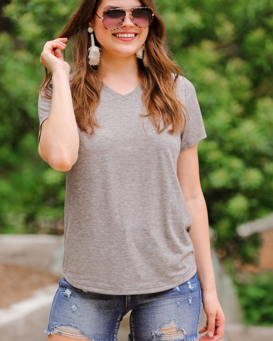 short-sleeved tee made of soft, breathable fabric with a V-neckline and a rounded hemline in heathered grey