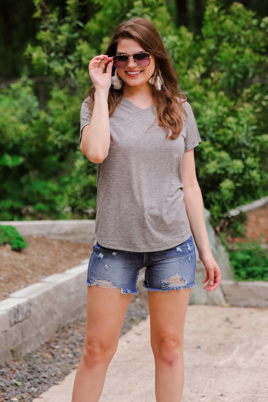 short-sleeved tee made of soft, breathable fabric with a V-neckline and a rounded hemline in heathered grey
