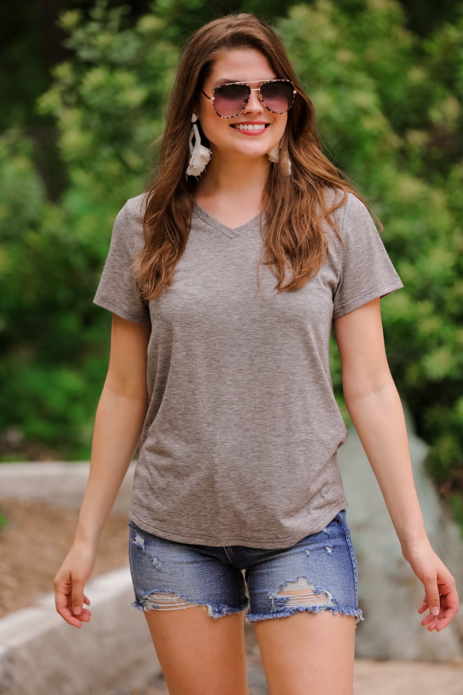 short-sleeved tee made of soft, breathable fabric with a V-neckline and a rounded hemline in heathered grey