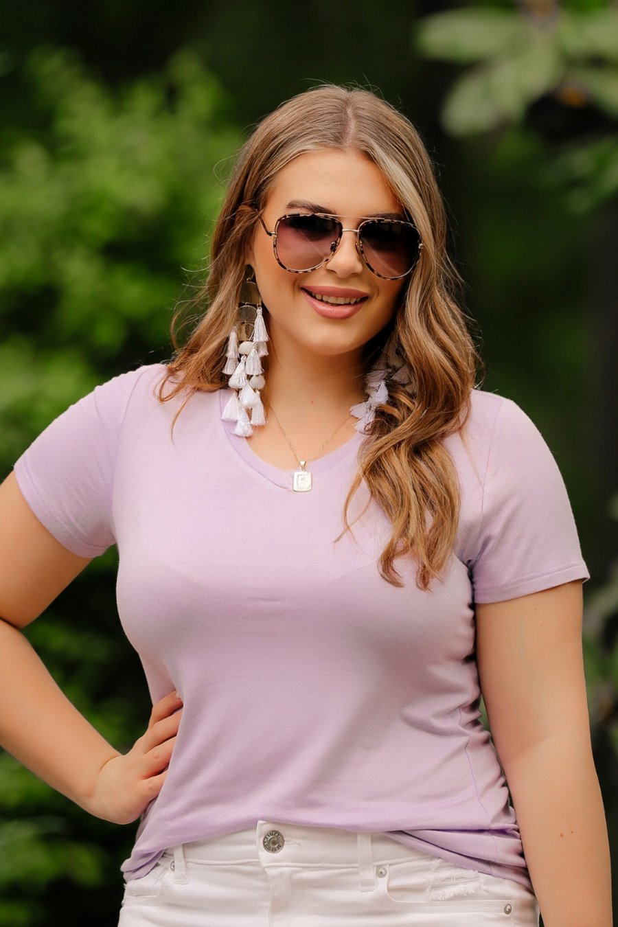 short-sleeved tee made of soft, breathable fabric with a V-neckline and a rounded hemline in lavender