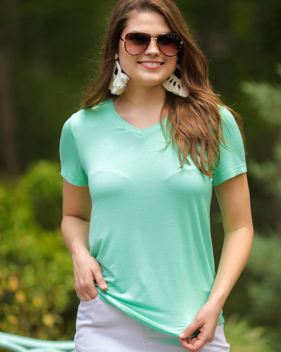 short-sleeved tee made of soft, breathable fabric with a V-neckline and a rounded hemline in spearmint