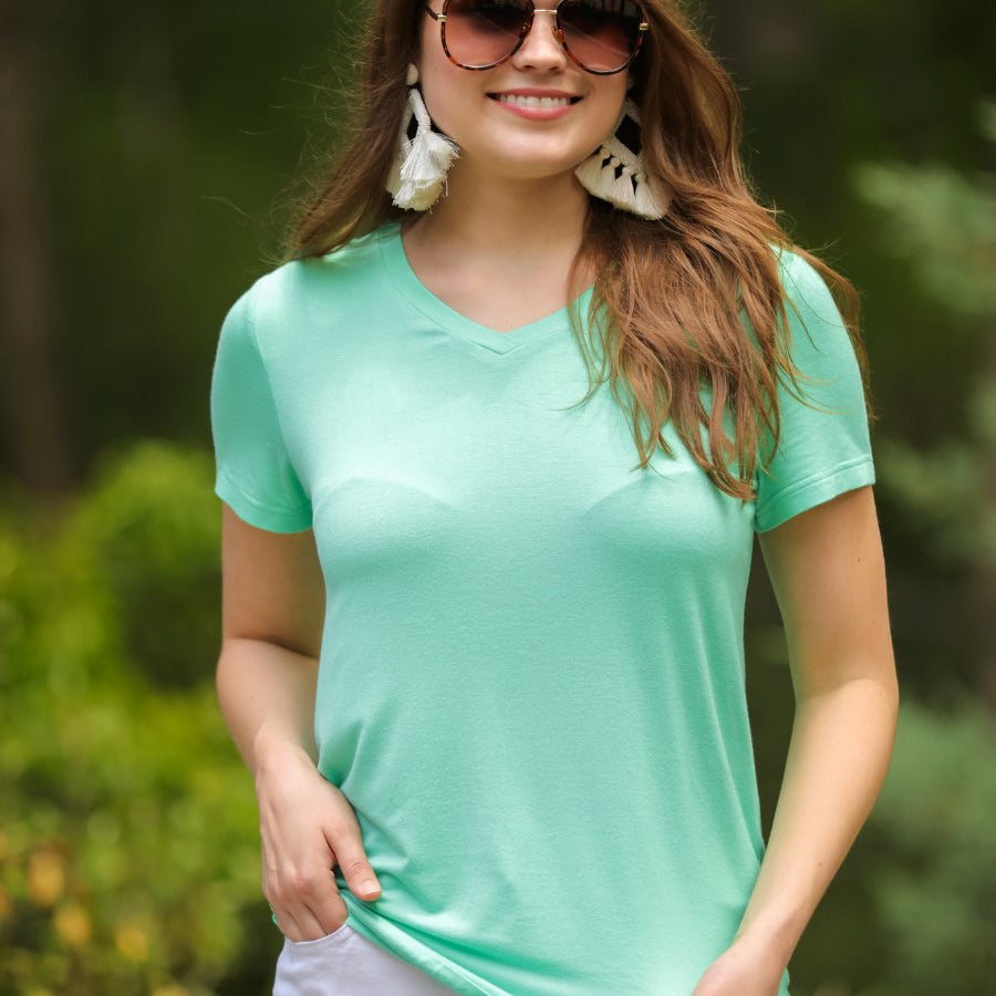 short-sleeved tee made of soft, breathable fabric with a V-neckline and a rounded hemline in spearmint