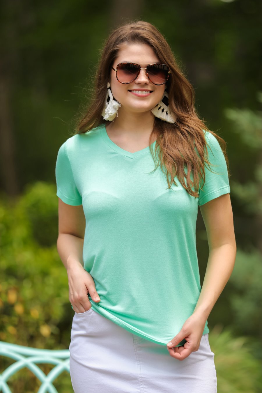 short-sleeved tee made of soft, breathable fabric with a V-neckline and a rounded hemline in spearmint