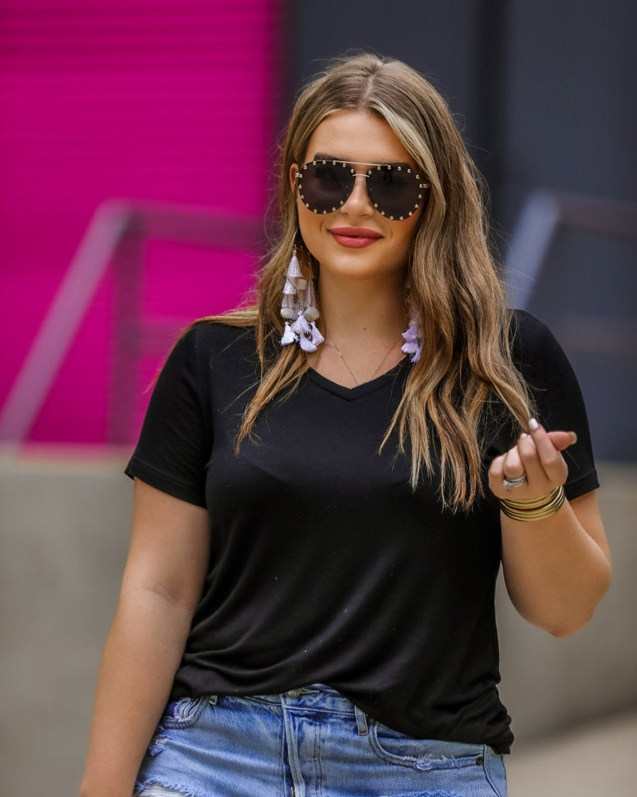 short-sleeved tee made of soft, breathable fabric with a V-neckline and a rounded hemline in black