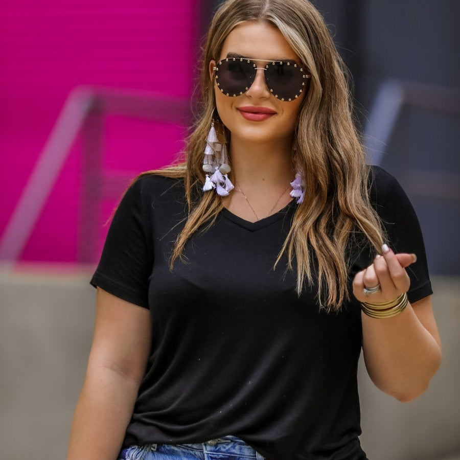 short-sleeved tee made of soft, breathable fabric with a V-neckline and a rounded hemline in black