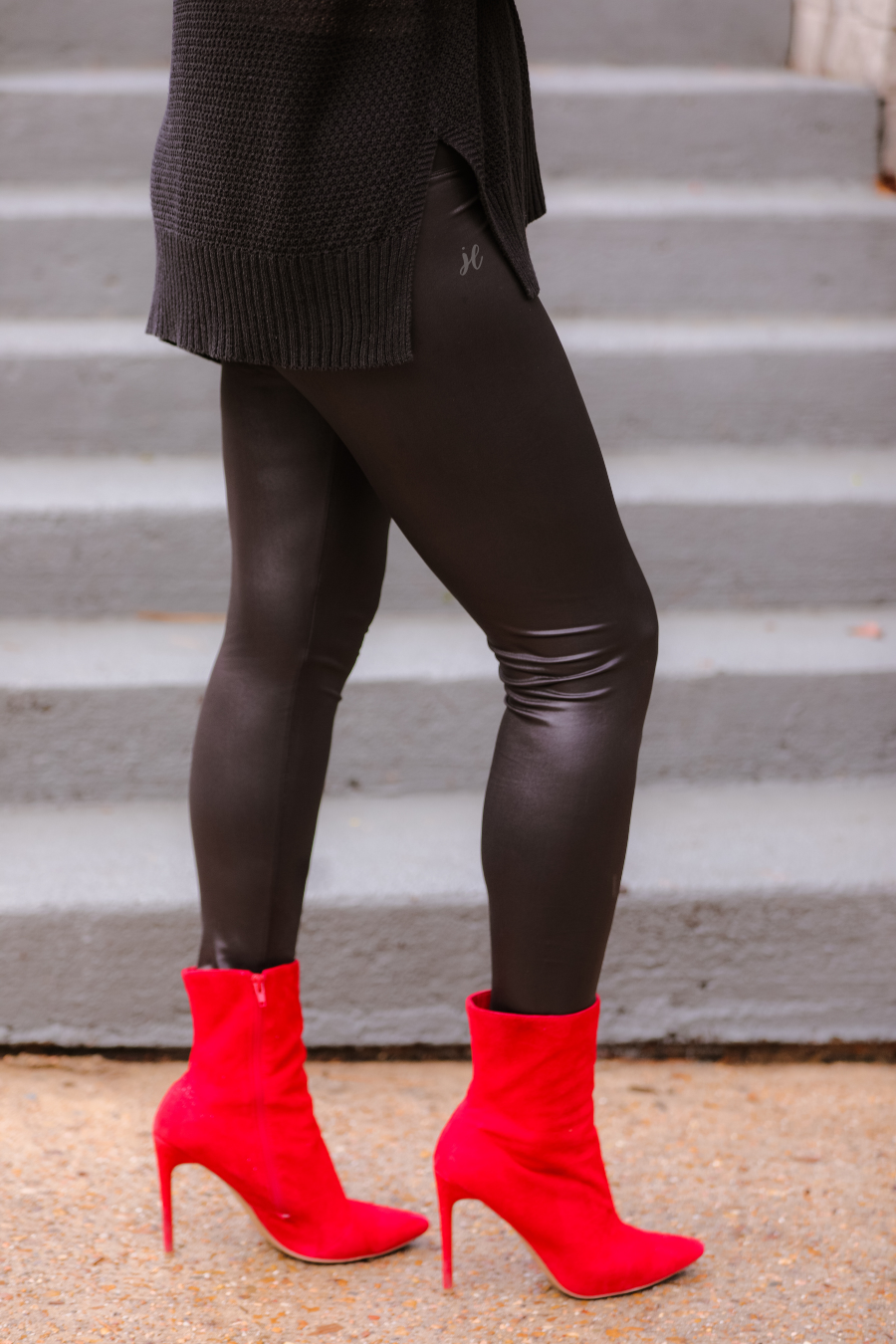 solid black lightweight leggings crafted from figure hugging faux leather with a high rise elastic waistband for tummy control and ankle length silhouette