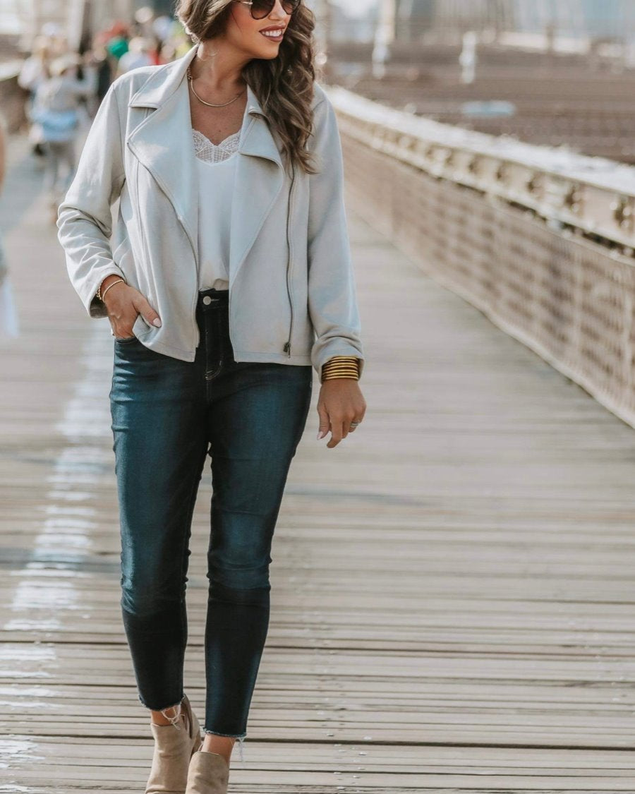 long sleeve faux suede grey jacket made of soft material with an oblique zipper closure, a classic collar, and side pockets