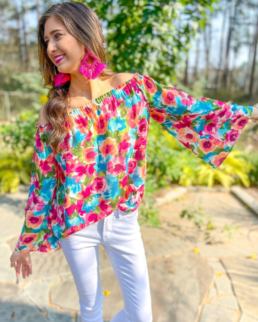 off-the-shoulder flow top with an elastic neckline in a vibrant exclusive floral pattern in multicolor