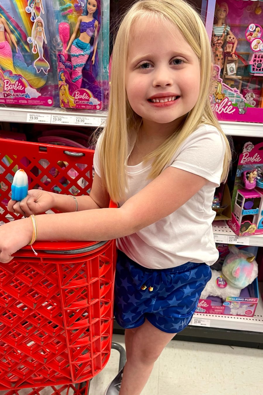 mid-rise relaxed fit activewear shorts with side pockets and a tie waist drawstring with gold bead accents, designed on a blue star-patterned print fabric, royal blue base, and royal blue trims