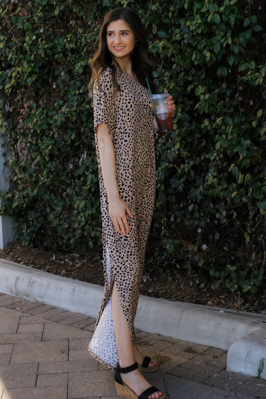a maxi dress with a trendy one-shoulder neckline, a relaxed short sleeve, functional side pockets, subtle side slits, and square hemline on a black leopard pattern and taupe base