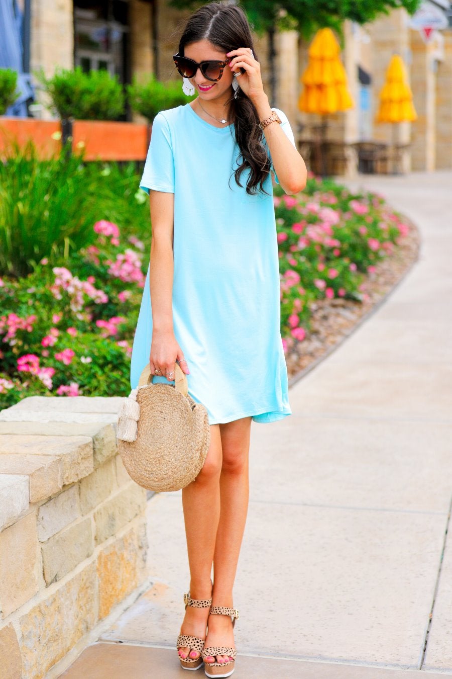 short sleeves made of super soft fabric with a round neckline, A-line style with a straight hemline, and a front chest pocket in aqua