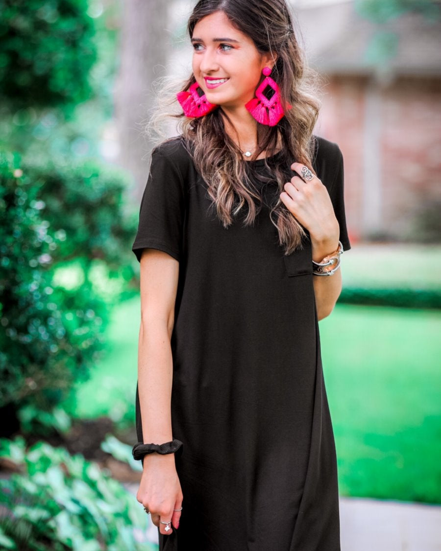 short sleeves made of super soft fabric with a round neckline, A-line style with a straight hemline, and a front chest pocket in black