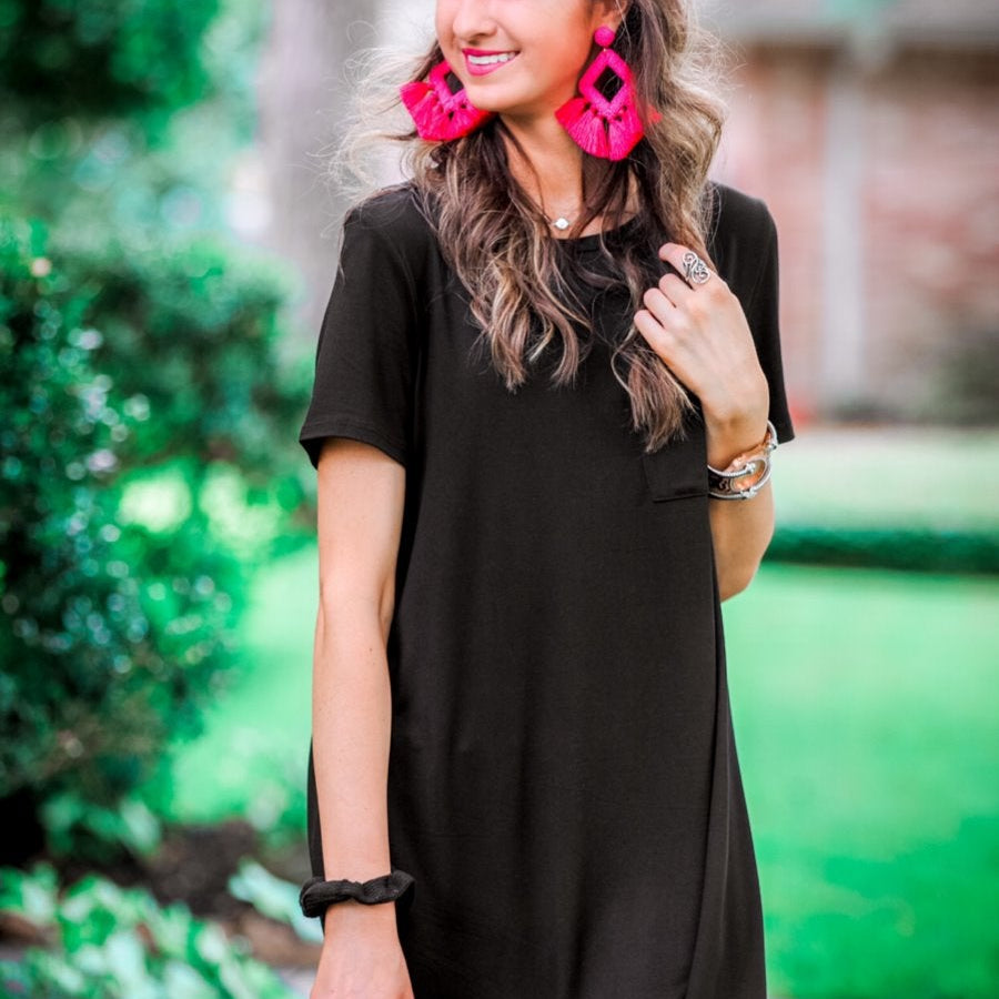 short sleeves made of super soft fabric with a round neckline, A-line style with a straight hemline, and a front chest pocket in black