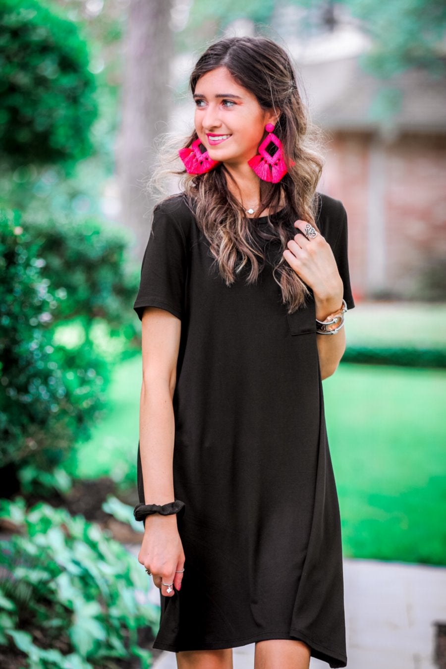 short sleeves made of super soft fabric with a round neckline, A-line style with a straight hemline, and a front chest pocket in black