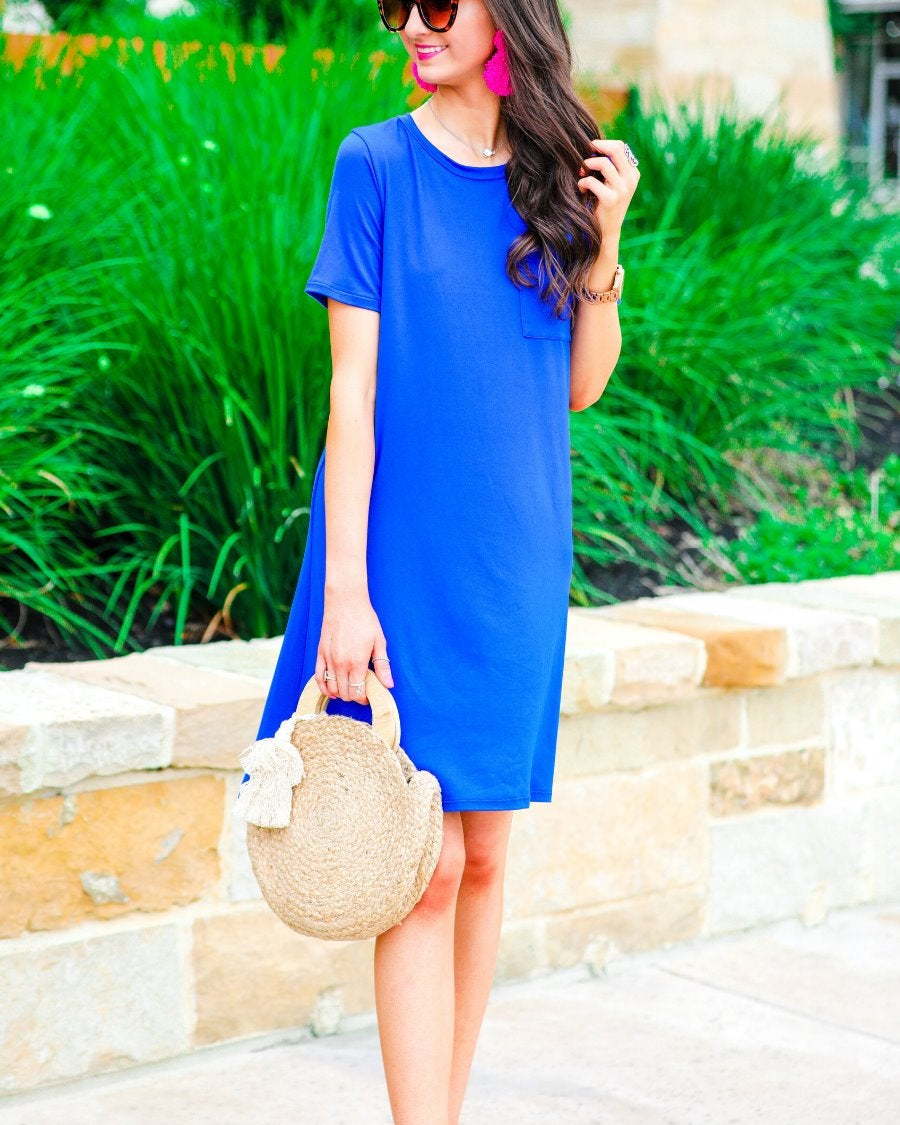 short sleeves made of super soft fabric with a round neckline, A-line style with a straight hemline, and a front chest pocket in royal blue