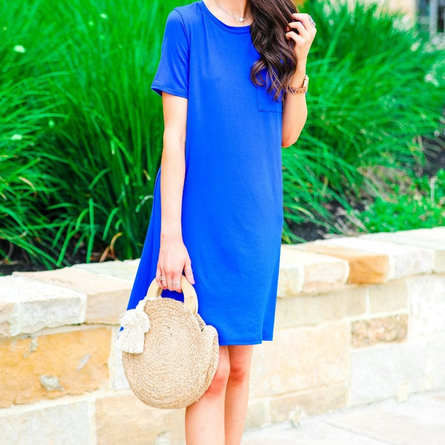 short sleeves made of super soft fabric with a round neckline, A-line style with a straight hemline, and a front chest pocket in royal blue