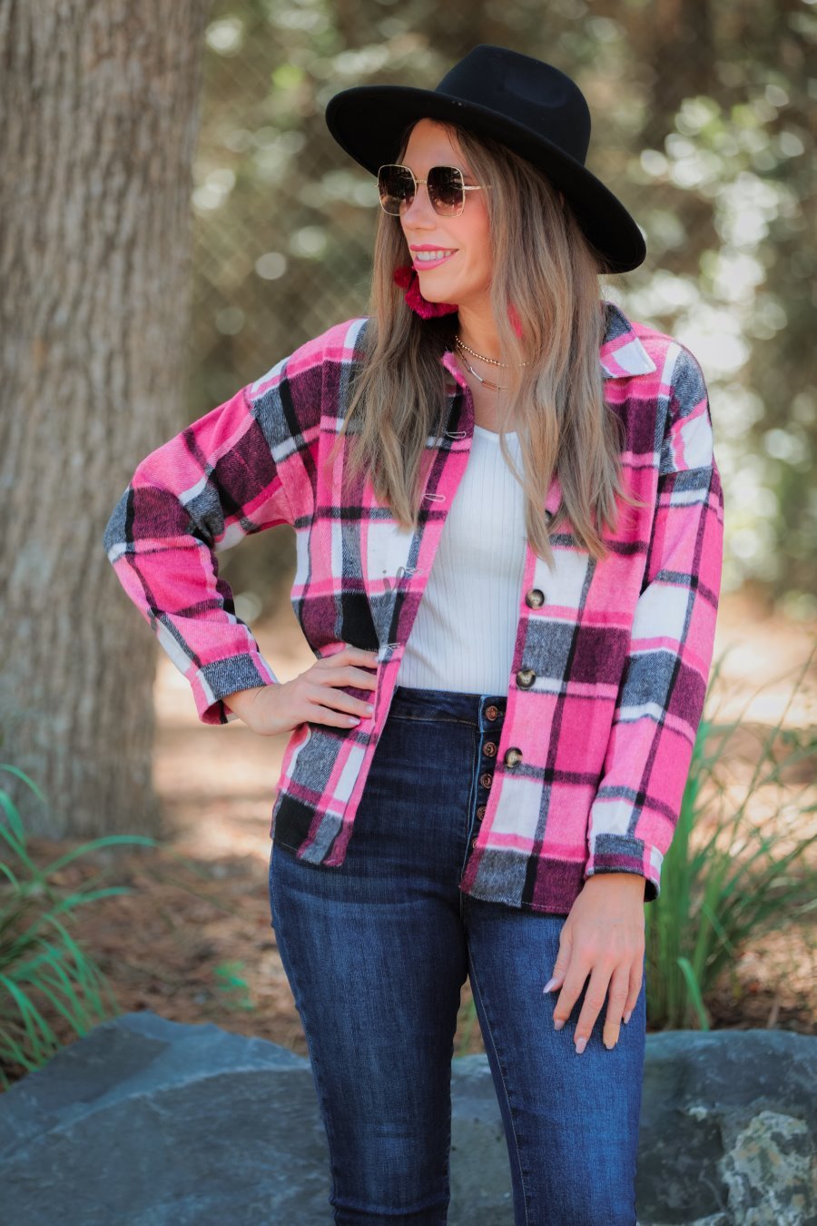 long sleeve shacket with fitted button closure cuffs, a button-down front, and a collared neckline on a pink plaid print