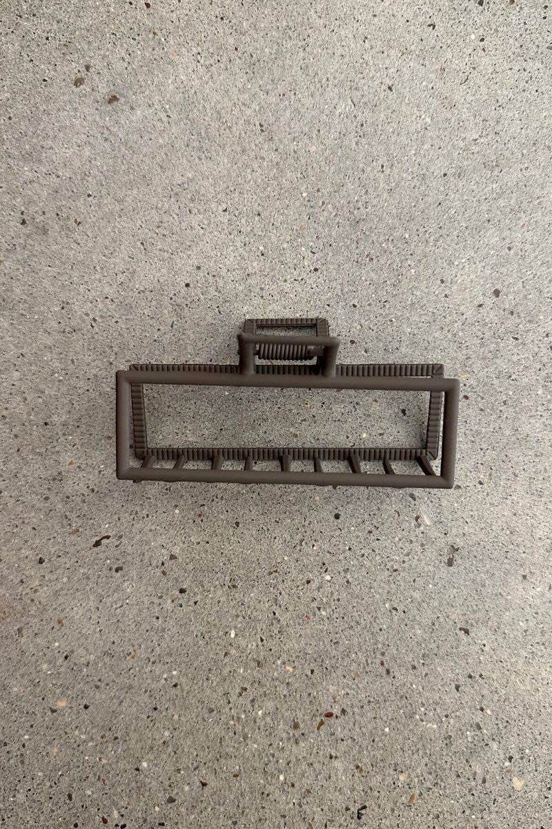 a metal neutral rectangular claw clip with a secure hold that reduces breakage in brown