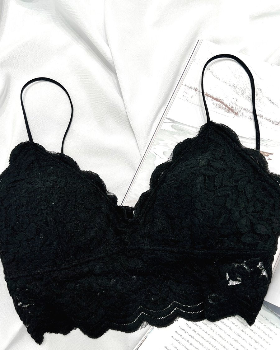 crochet lace bralette with a pullover style, a V-neckline, adjustable straps, and removable pads in black