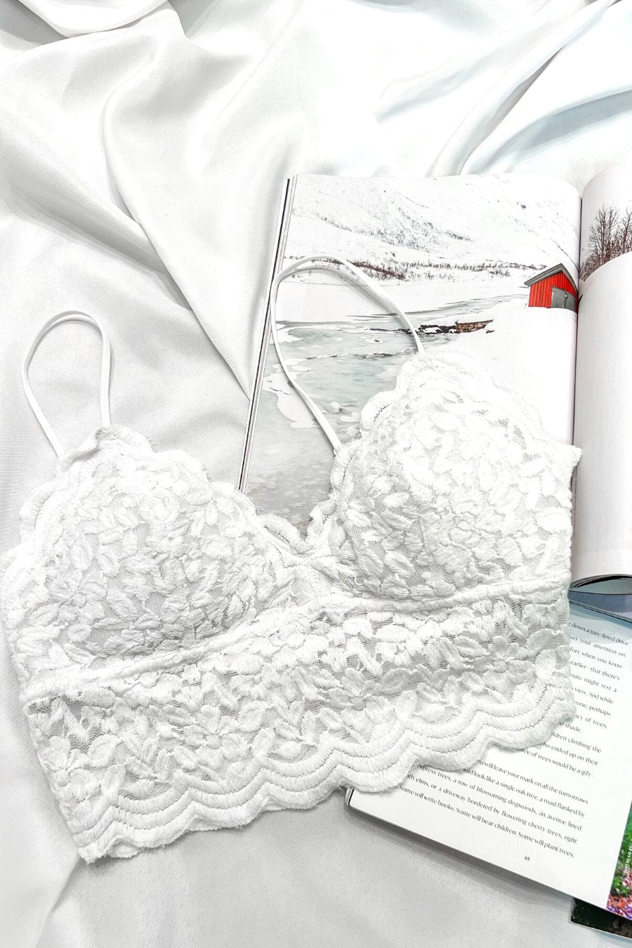 crochet lace bralette with a pullover style, a V-neckline, adjustable straps, and removable pads in ivory