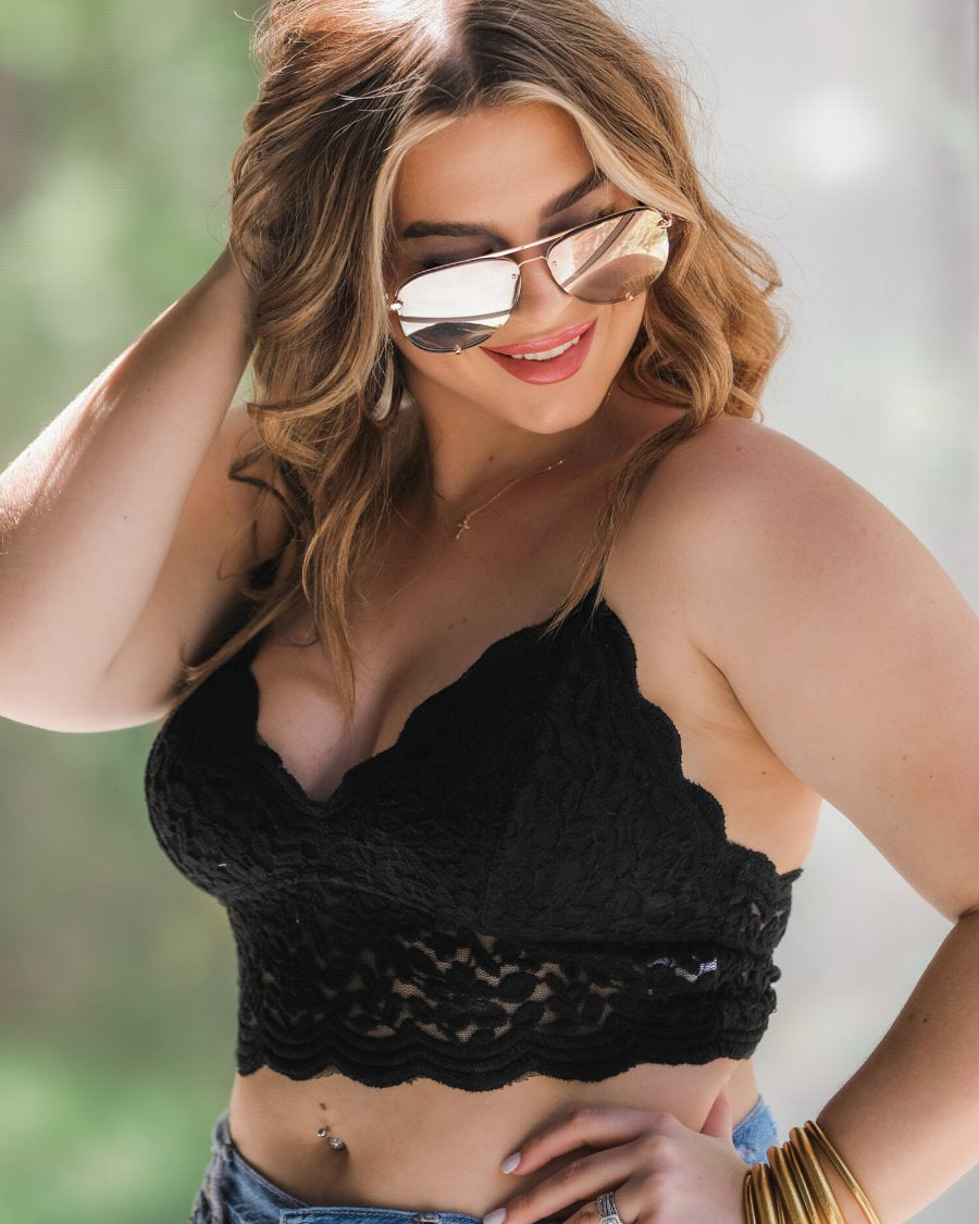 crochet lace bralette with a pullover style, a V-neckline, adjustable straps, and removable pads in black