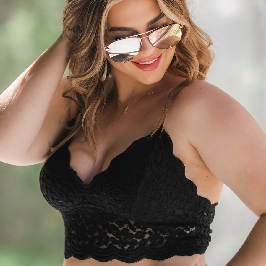 crochet lace bralette with a pullover style, a V-neckline, adjustable straps, and removable pads in black