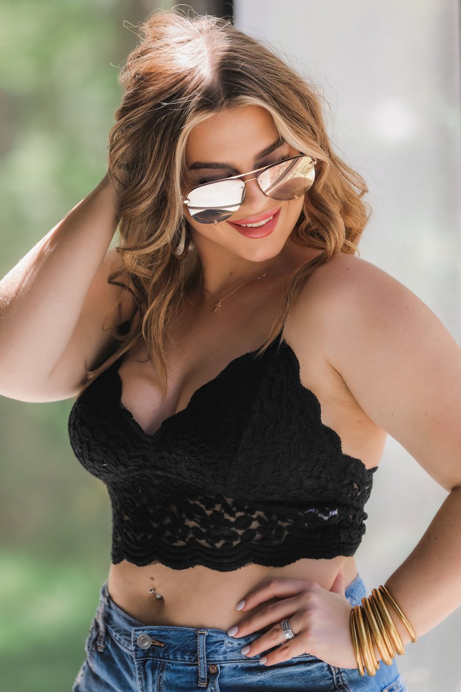 crochet lace bralette with a pullover style, a V-neckline, adjustable straps, and removable pads in black