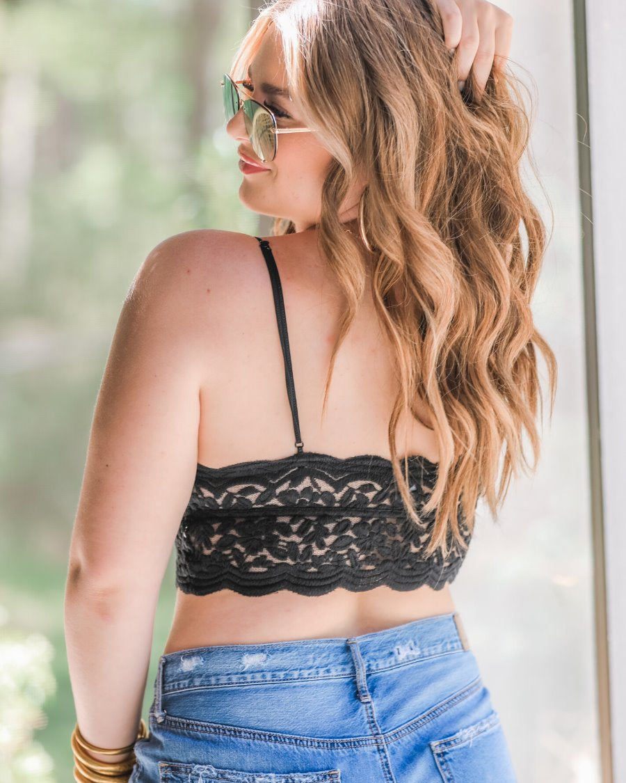 crochet lace bralette with a pullover style, a V-neckline, adjustable straps, and removable pads in black