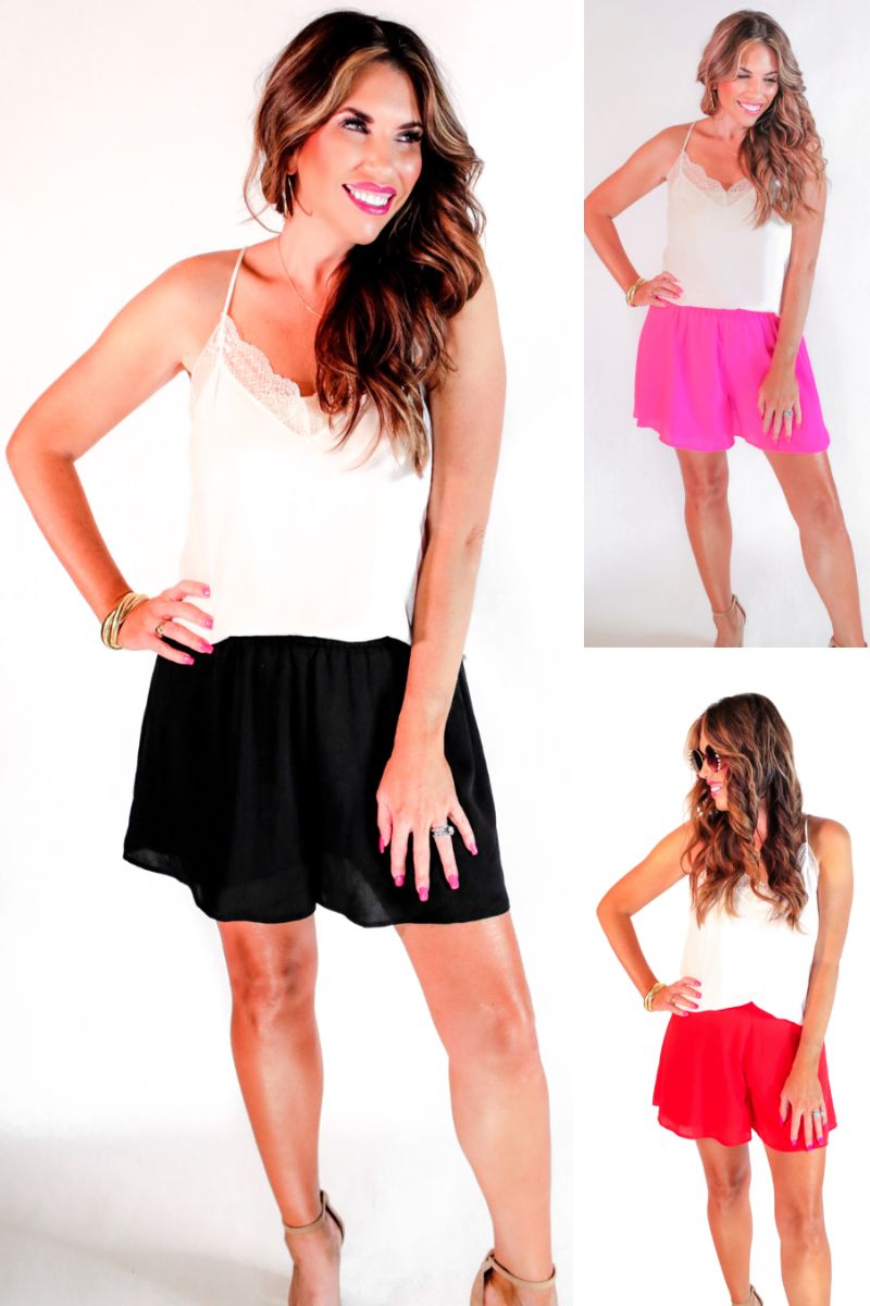 swing shorts with a relaxed fit, an elastic waistband, pocket-free design, breezy drape, and a skirt-inspired silhouette in black, pink, and red