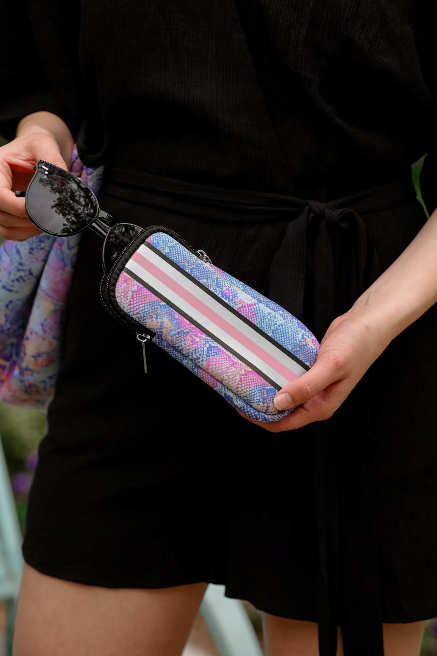 ultra-lightweight sunglasses case made of neoprene with a top double zipper in silver hardware and corresponding racing stripes in multi snake