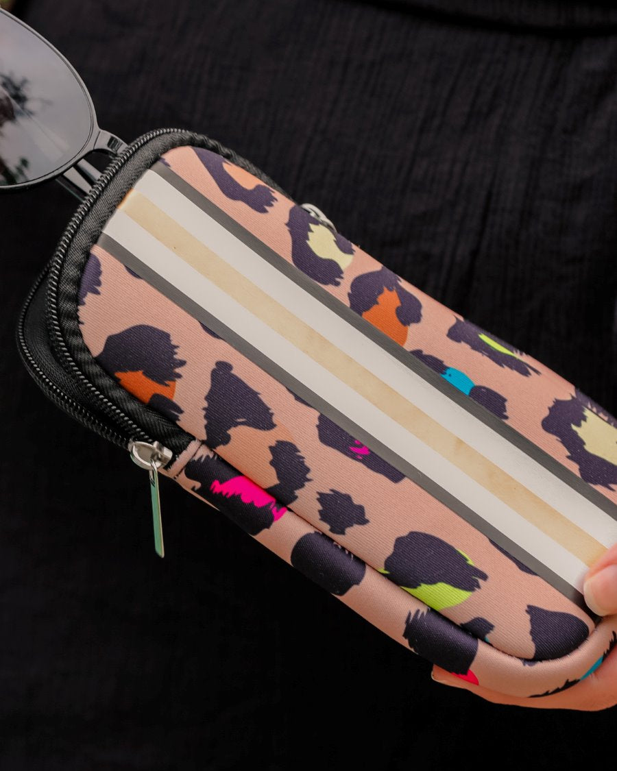 ultra-lightweight sunglasses case made of neoprene with a top double zipper in silver hardware and corresponding racing stripes in multi leopard