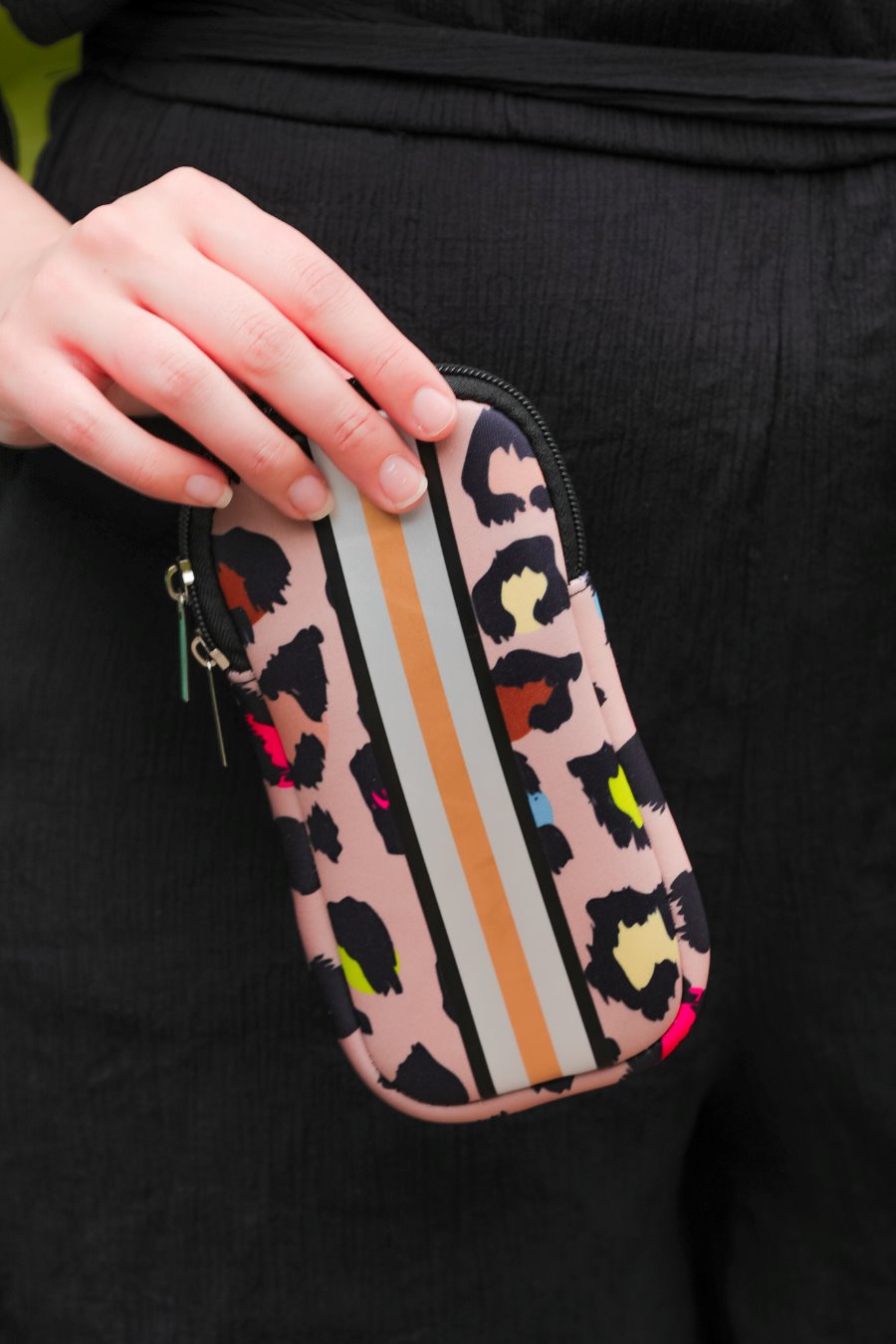 ultra-lightweight sunglasses case made of neoprene with a top double zipper in silver hardware and corresponding racing stripes in multi leopard