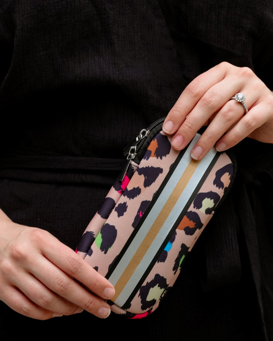ultra-lightweight sunglasses case made of neoprene with a top double zipper in silver hardware and corresponding racing stripes in multi leopard