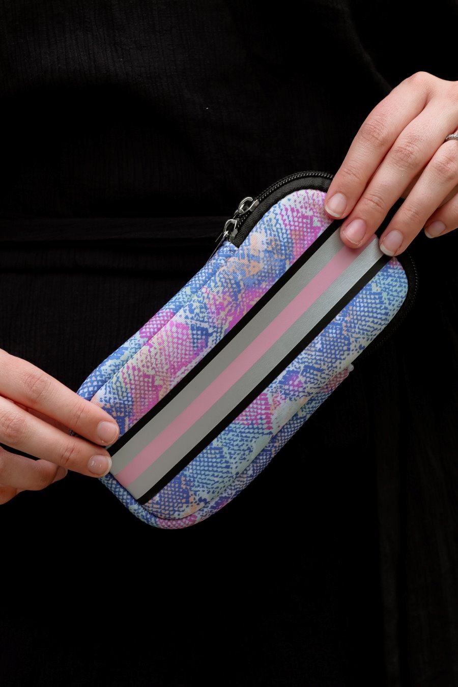 ultra-lightweight sunglasses case made of neoprene with a top double zipper in silver hardware and corresponding racing stripes in multi snake