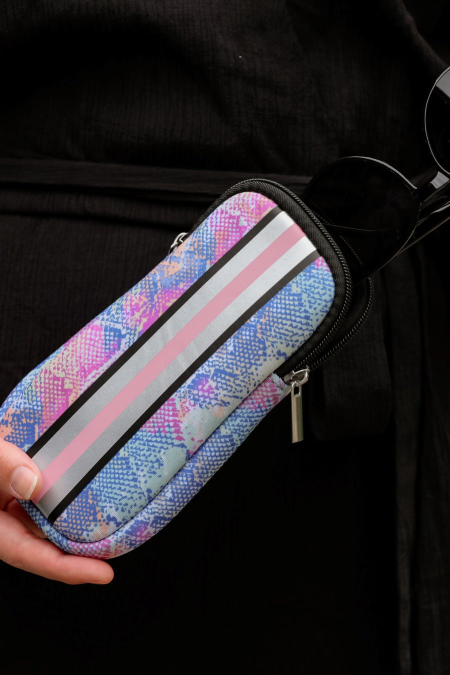 ultra-lightweight sunglasses case made of neoprene with a top double zipper in silver hardware and corresponding racing stripes in multi snake