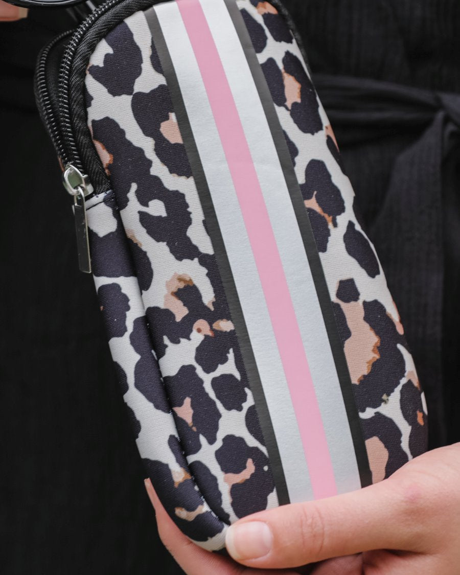 ultra-lightweight sunglasses case made of neoprene with a top double zipper in silver hardware and corresponding racing stripes in tan leopard