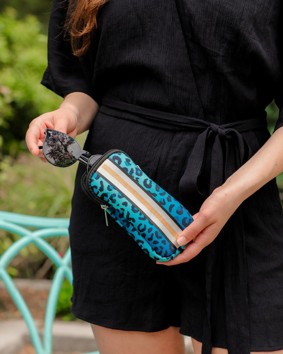 ultra-lightweight sunglasses case made of neoprene with a top double zipper in silver hardware and corresponding racing stripes in turquoise leopard