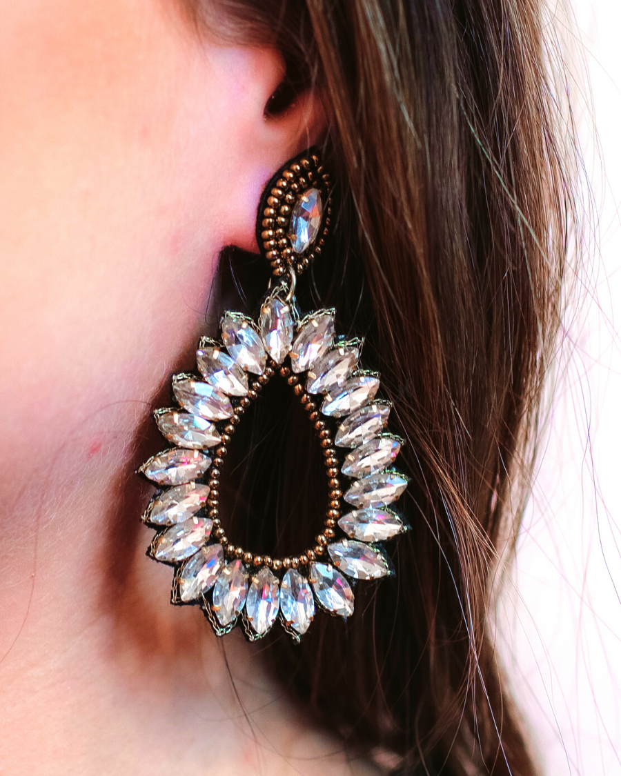 gold rhinestone-embellished teardrop drop earrings with a subtle dangle movement, a coordinating stud top, soft felt backing, and secure comfort back