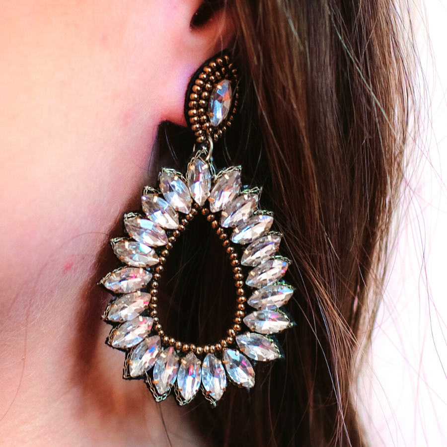 gold rhinestone-embellished teardrop drop earrings with a subtle dangle movement, a coordinating stud top, soft felt backing, and secure comfort back