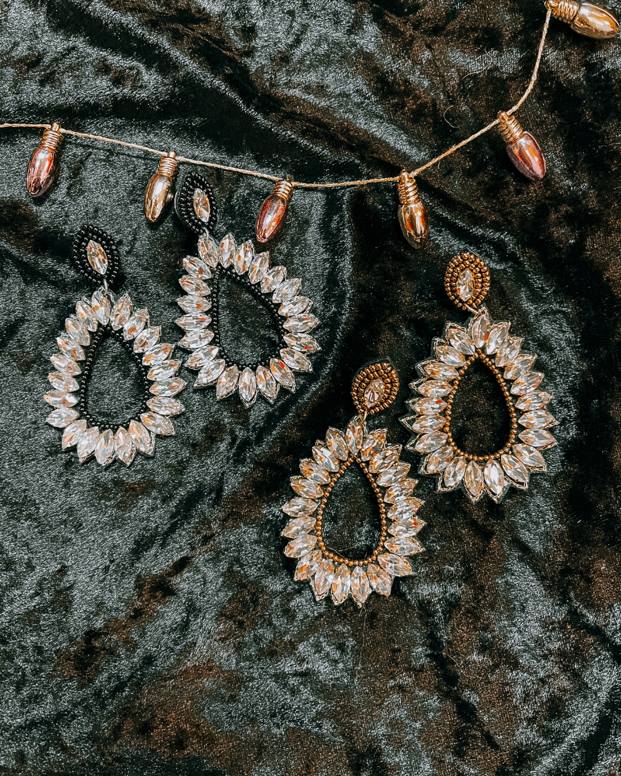 rhinestone-embellished teardrop drop earrings with a subtle dangle movement, a coordinating stud top, soft felt backing, and secure comfort back in black or gold