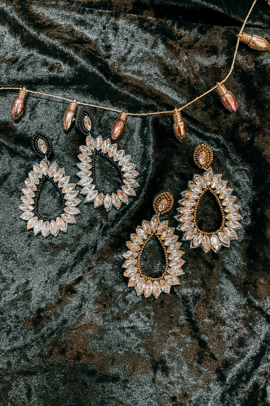 rhinestone-embellished teardrop drop earrings with a subtle dangle movement, a coordinating stud top, soft felt backing, and secure comfort back in black or gold