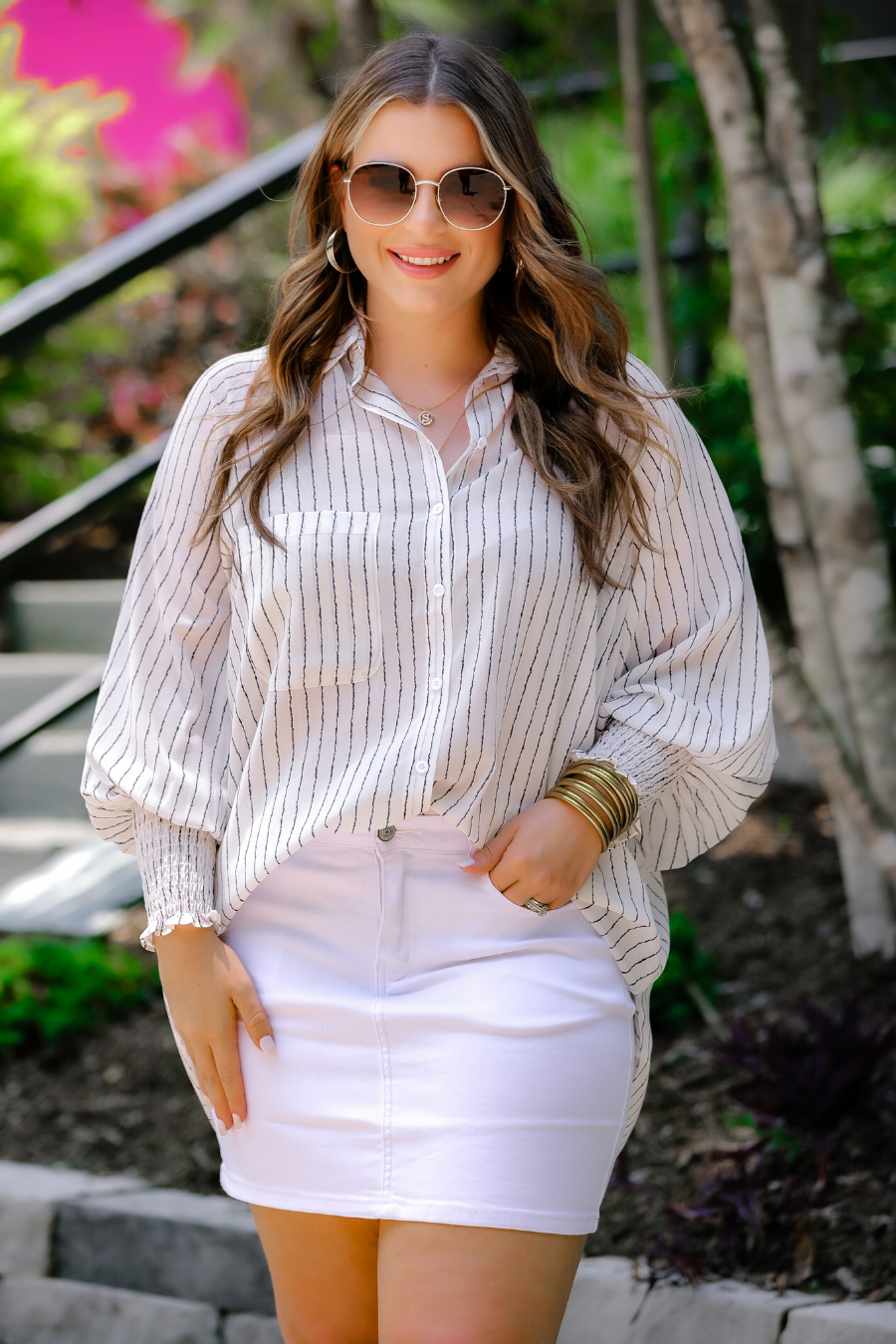 a classic white denim skirt with a little stretch, five-pocket style, and a zip fly with button closure