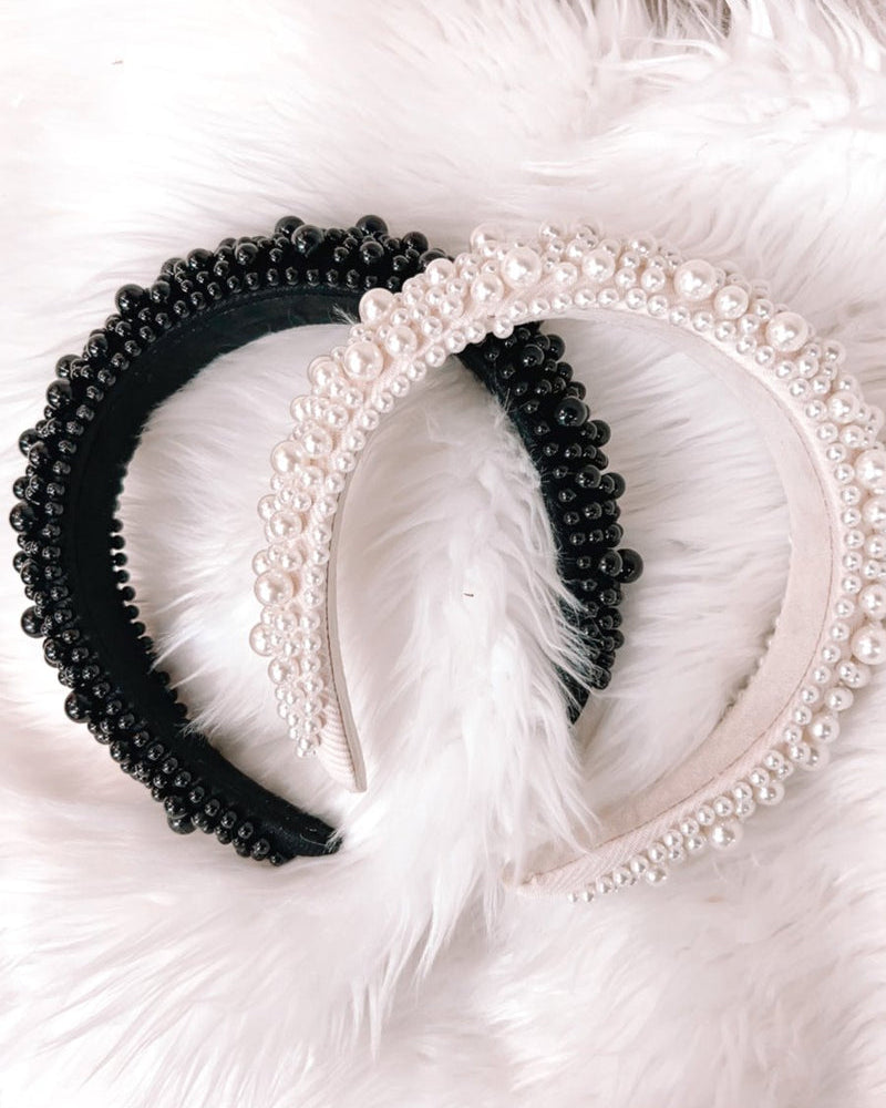 a soft, structured headband adorned with beautifully clustered pearls in varying sizes in black and ivory