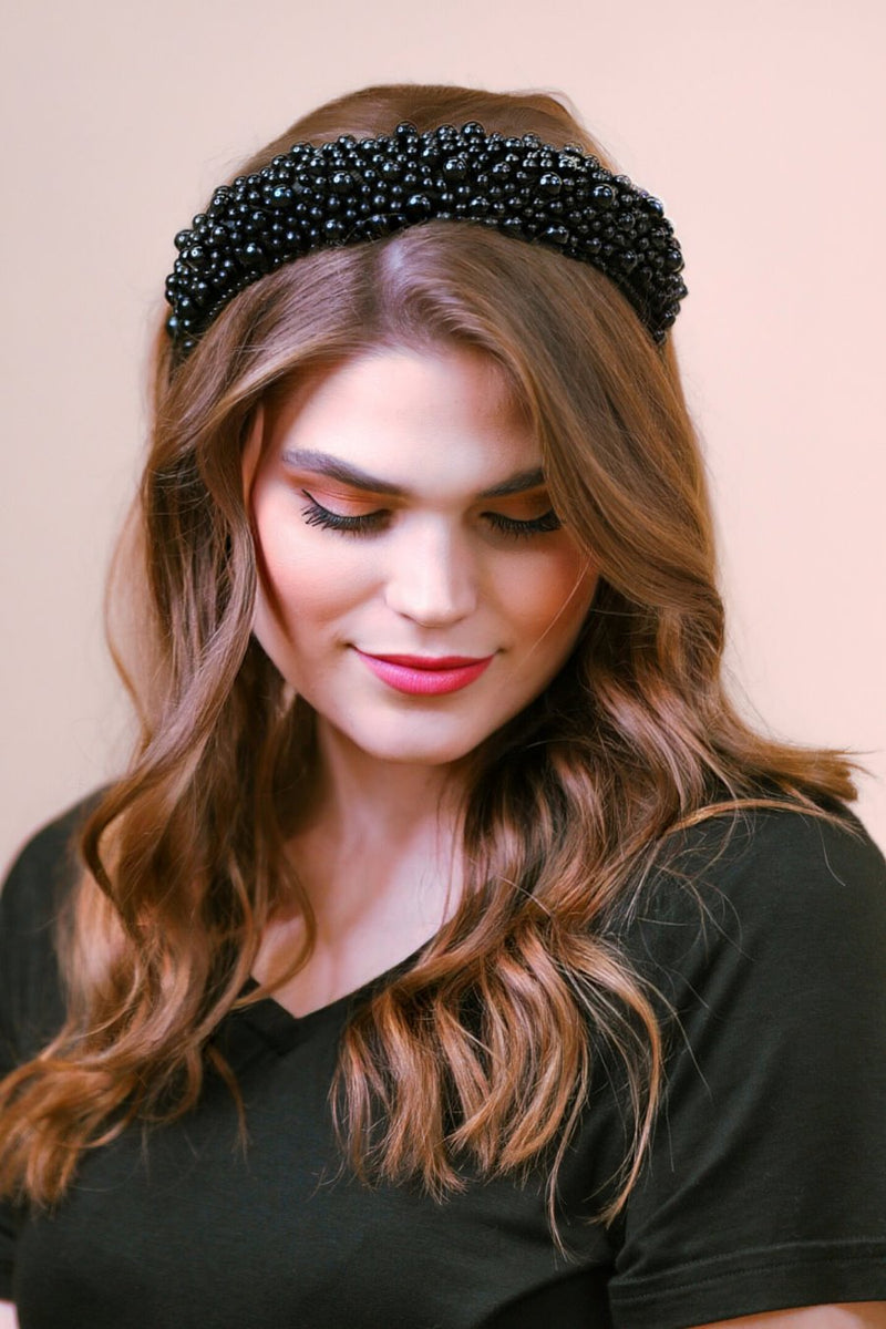 a soft, structured headband adorned with beautifully clustered pearls in varying sizes in black