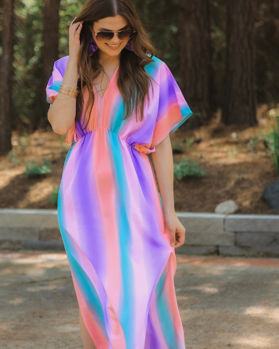 lightweight, breezy dress with colorful vertical stripes, a V-neckline, and an unlined, flowy fabric