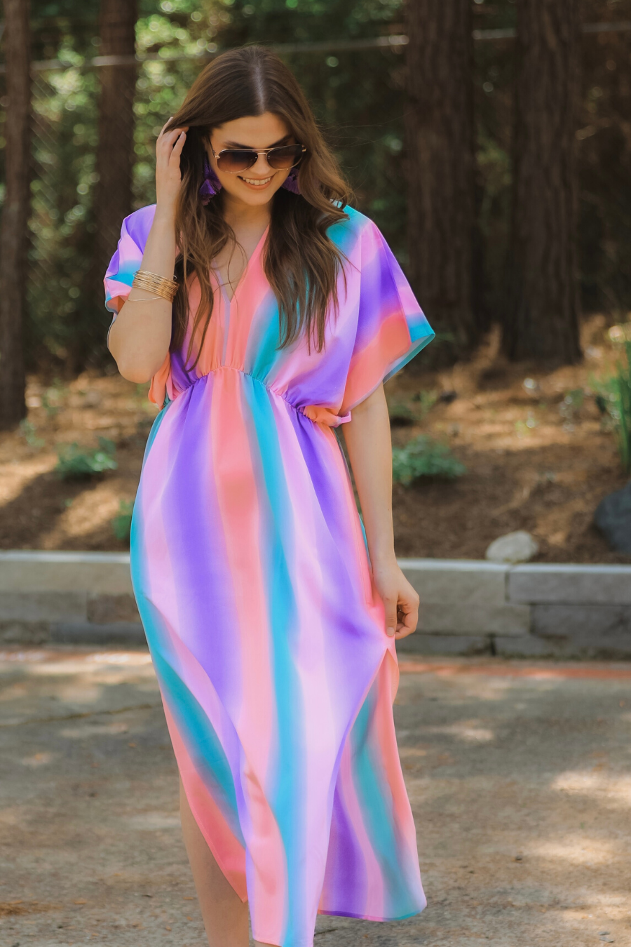 lightweight, breezy dress with colorful vertical stripes, a V-neckline, and an unlined, flowy fabric