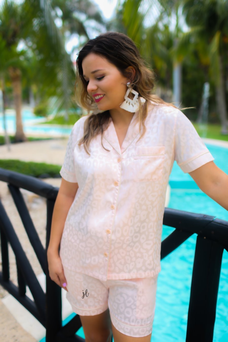 a champagne satin two-piece lounge set sold together with a tonal leopard pattern, collared button-down top, short sleeves, a chest pocket, piped trim, and matching shorts with an elastic drawstring waist and accent side pockets
