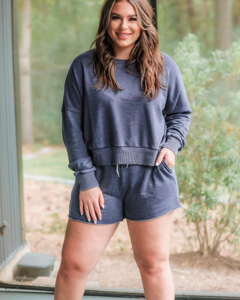vintage wash navy long sleeve top and short set with side pockets, an elastic drawstring waistband, and a relaxed fit on a super soft material