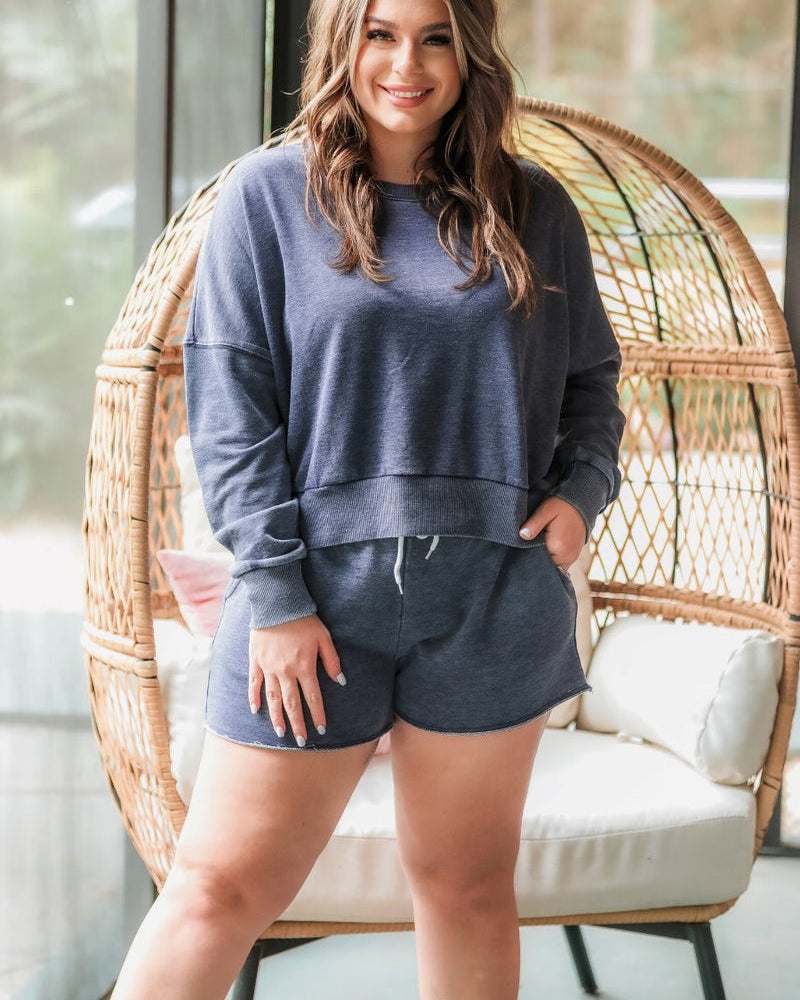 vintage wash navy long sleeve top and short set with side pockets, an elastic drawstring waistband, and a relaxed fit on a super soft material