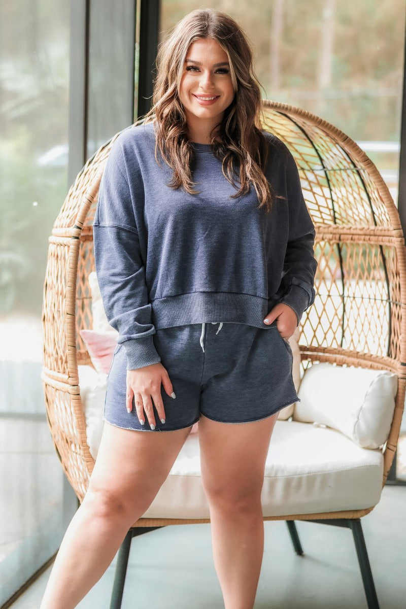 vintage wash navy long sleeve top and short set with side pockets, an elastic drawstring waistband, and a relaxed fit on a super soft material